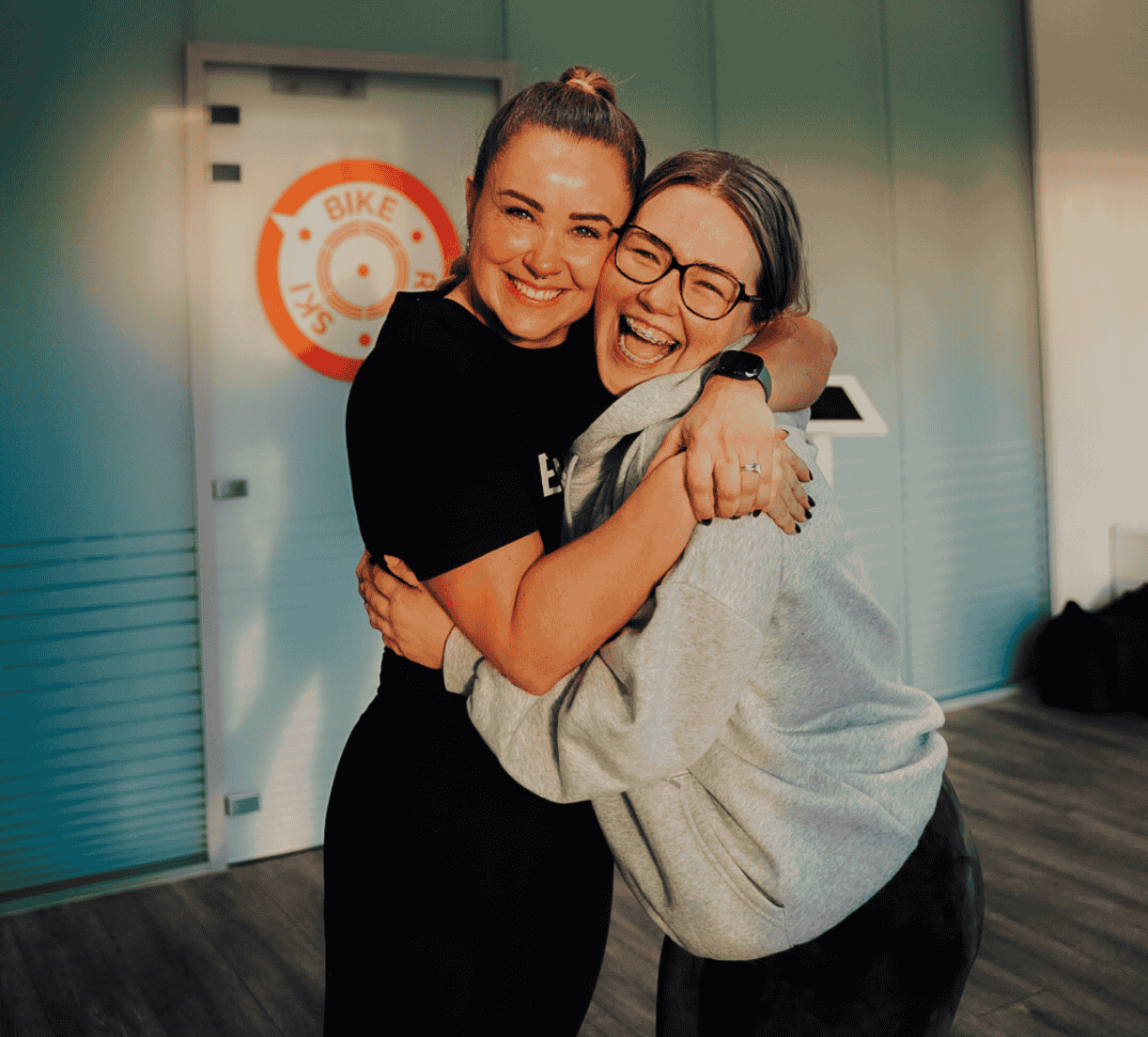 Supportive coach-led exercise at BikeRowSki helping members feel confident