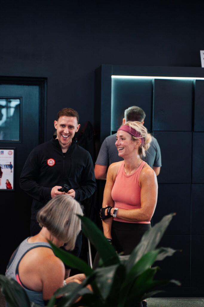 Supportive coaching at BikeRowSki helping members move well and feel good